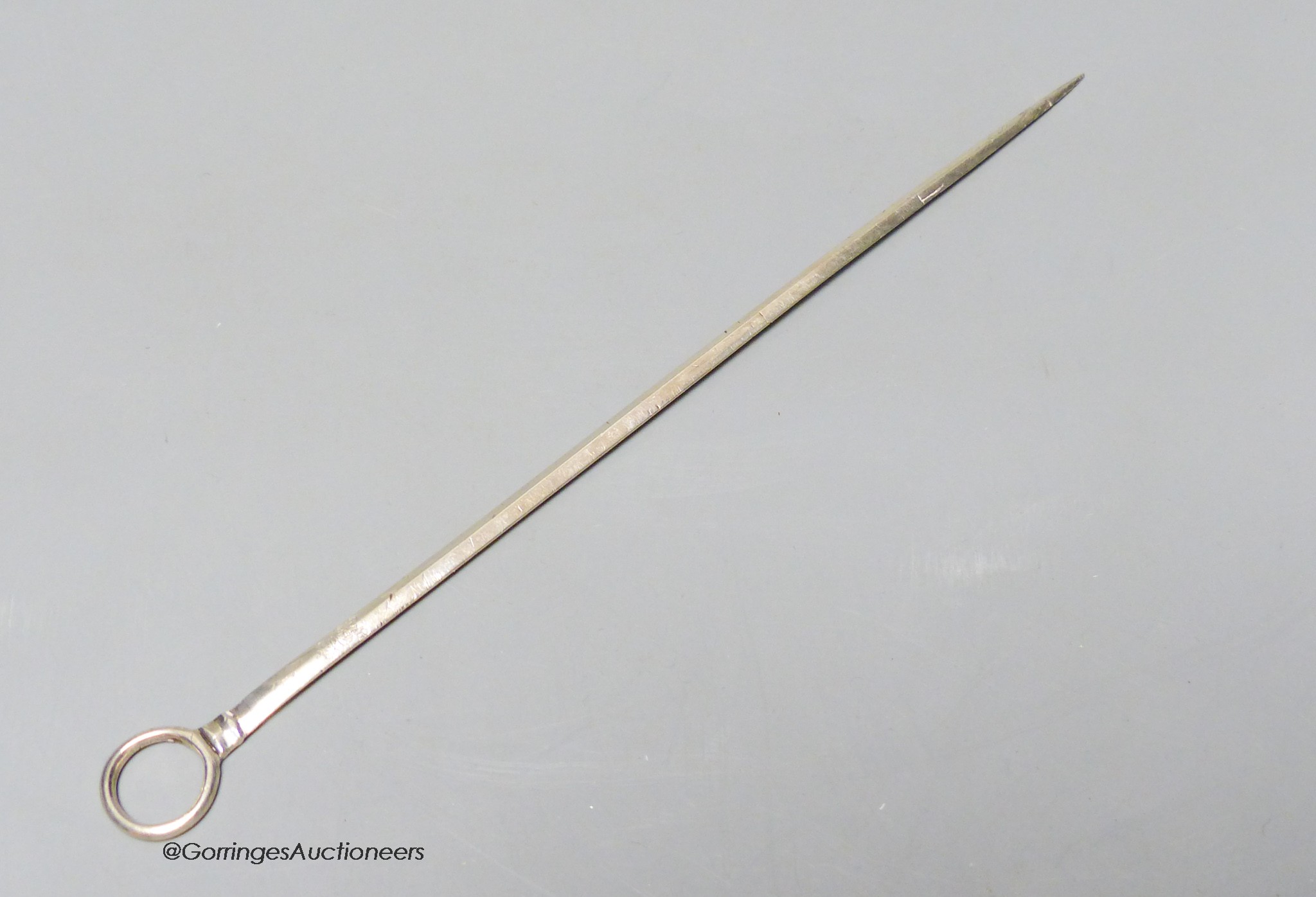 A George III white metal game skewer, unmarked, 22cm.